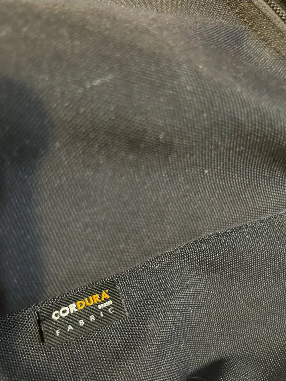 Carhartt WIP Payton Backpack Black Rounded Silhouette White Embroidered Branding
